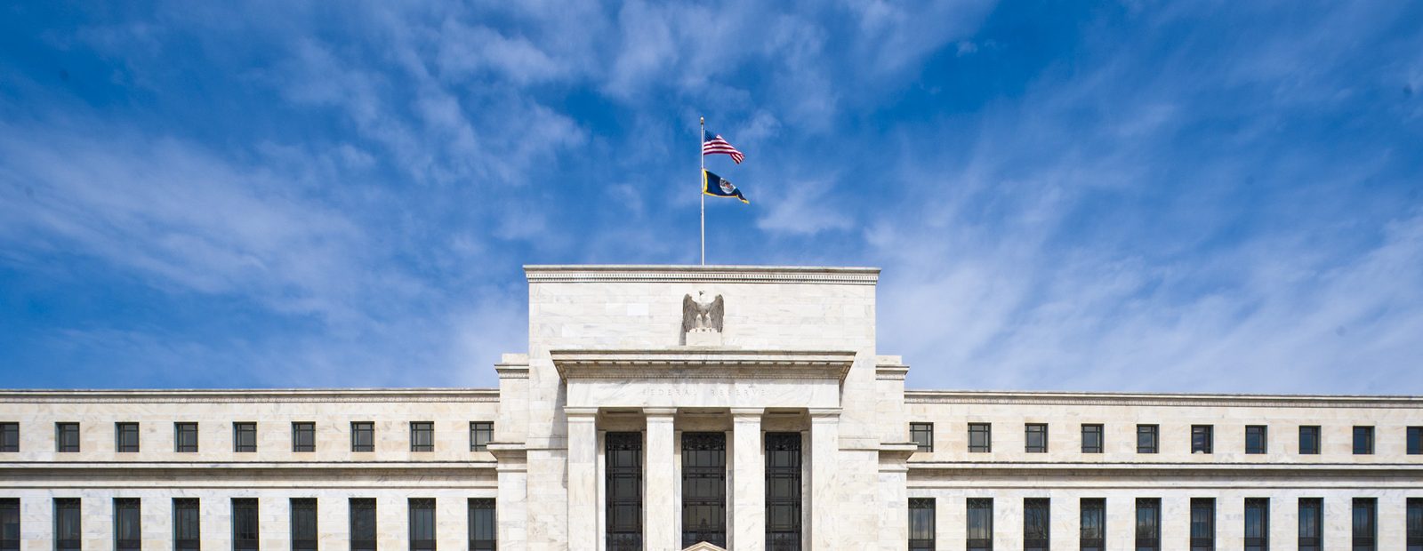 The Marriner S. Eccles Federal Reserve Board Building in Washington, DC, viewed straight on from the south lawn.